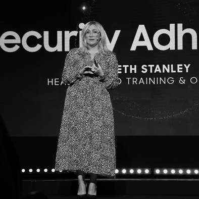 A person standing on a stageDescription automatically generated
