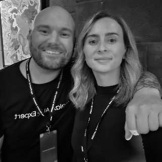 A person and person posing for a pictureDescription automatically generated