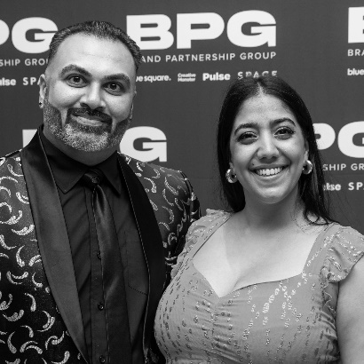 A person and person posing for a pictureDescription automatically generated