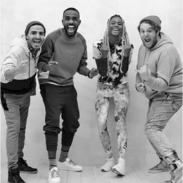 A group of men posing for a pictureDescription automatically generated